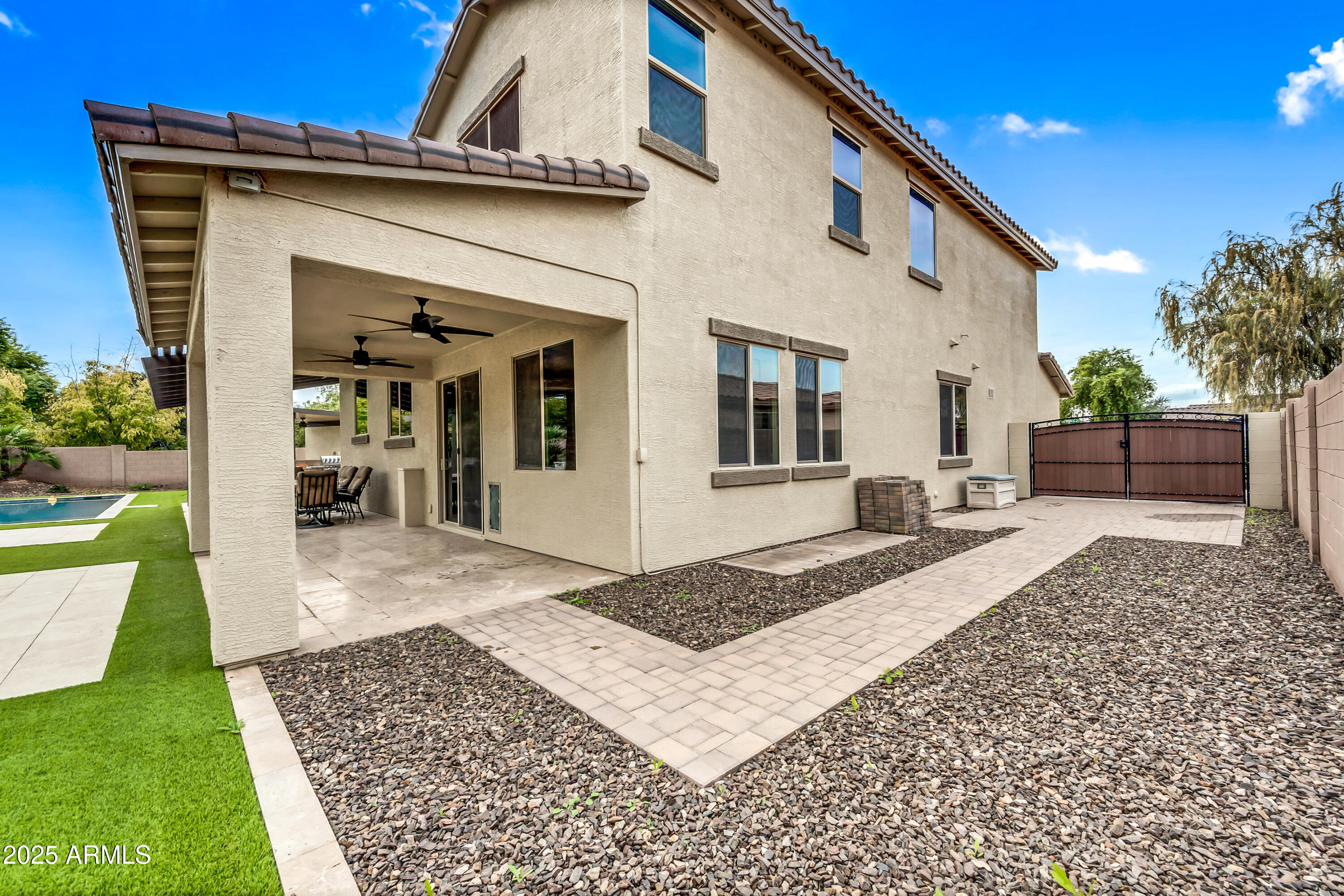 4587 South Ellesmere Street Gilbert, AZ 85297 - Photo 46 of 55 a view of a house with a yard