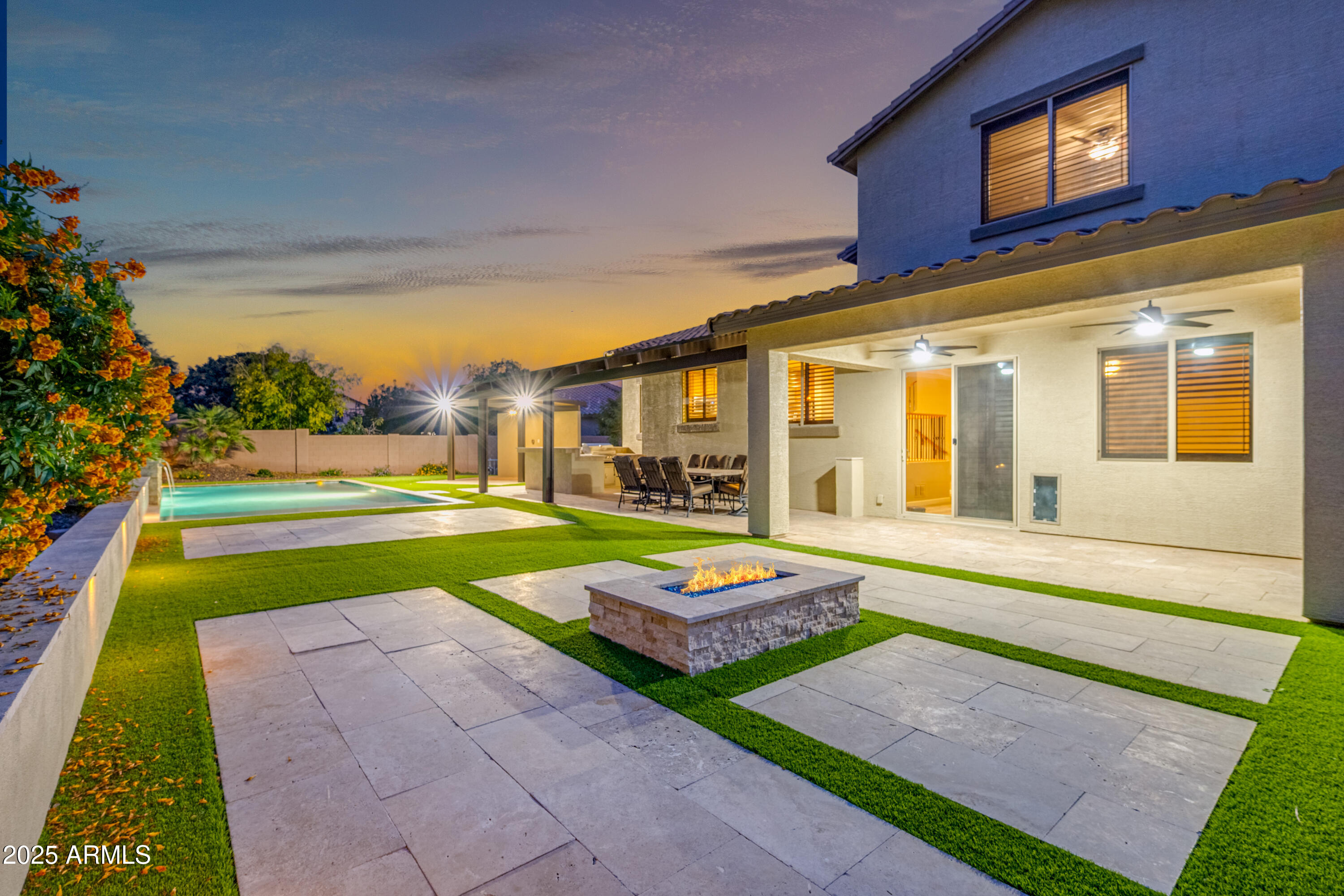 4587 South Ellesmere Street Gilbert, AZ 85297 - Photo 4 of 55 a swimming pool with yard in front of it