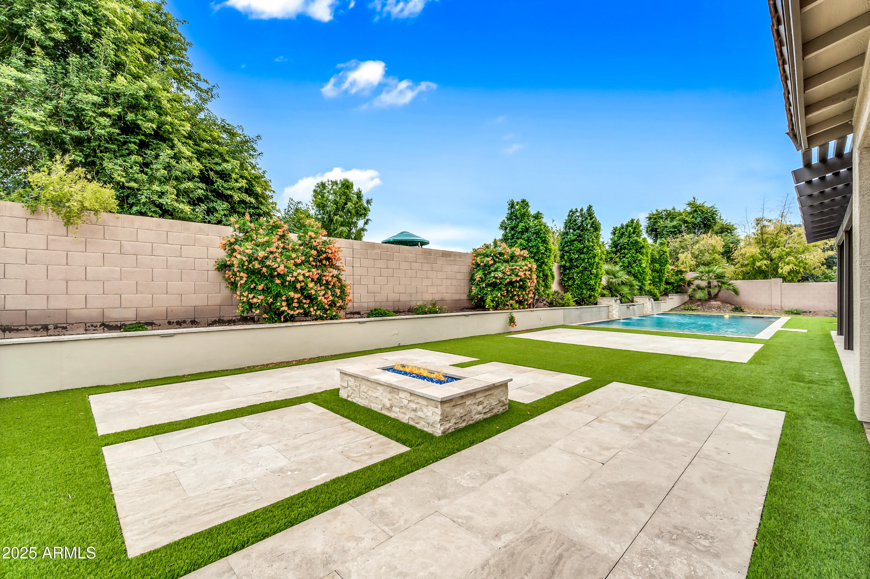 4587 South Ellesmere Street Gilbert, AZ 85297 - Photo 6 of 55 a view of swimming pool with outdoor seating and yard