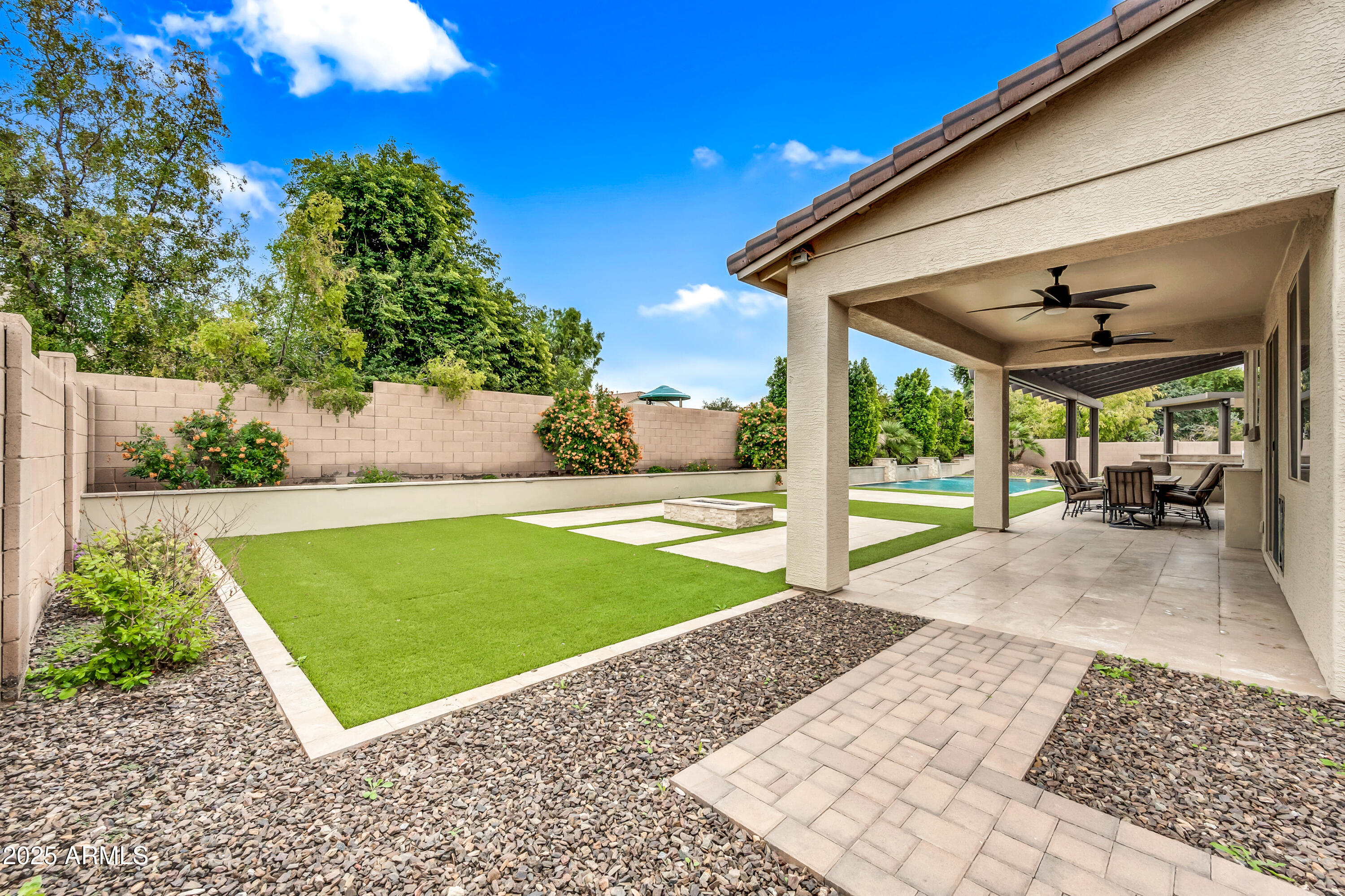4587 South Ellesmere Street Gilbert, AZ 85297 - Photo 8 of 55 a view of a backyard with a patio
