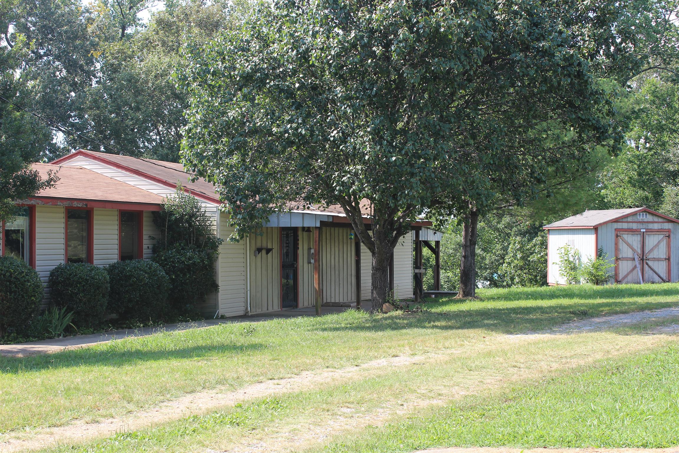 4029 Woodard Road Springfield, TN 37172 - Photo 1 of 16 a front view of a house with a garden