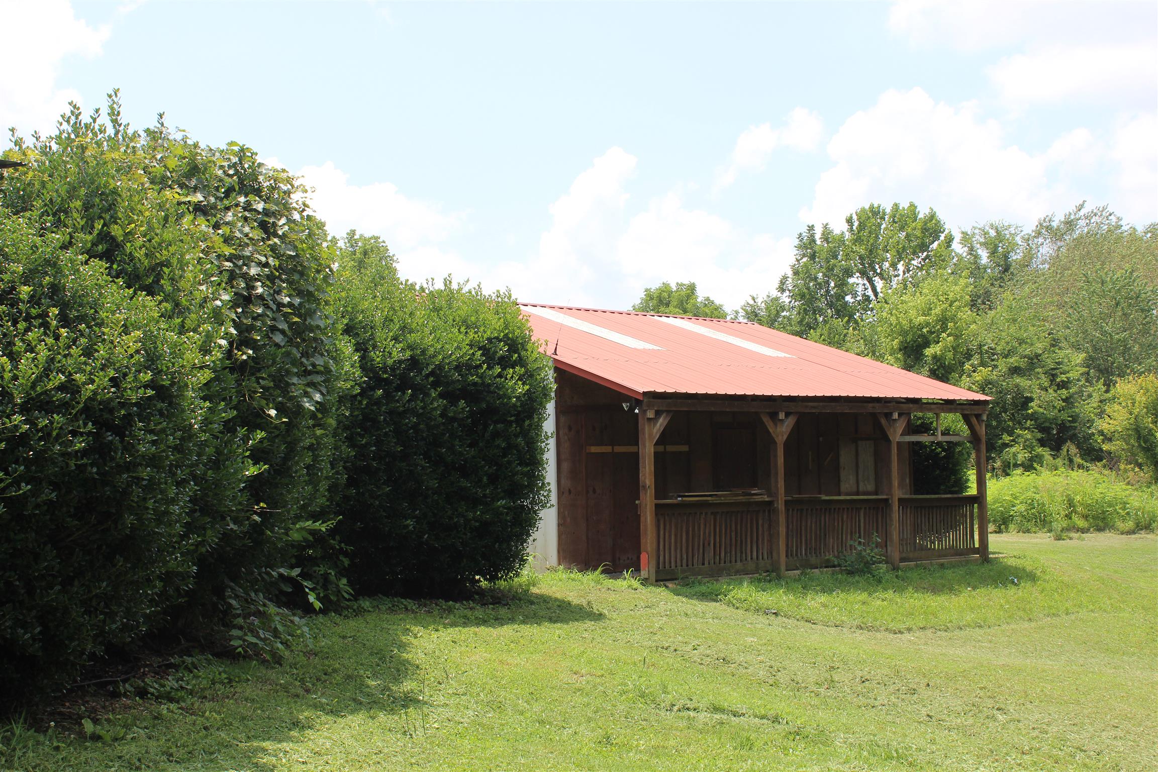 4029 Woodard Road Springfield, TN 37172 - Photo 13 of 16 a view of a backyard with a large tree