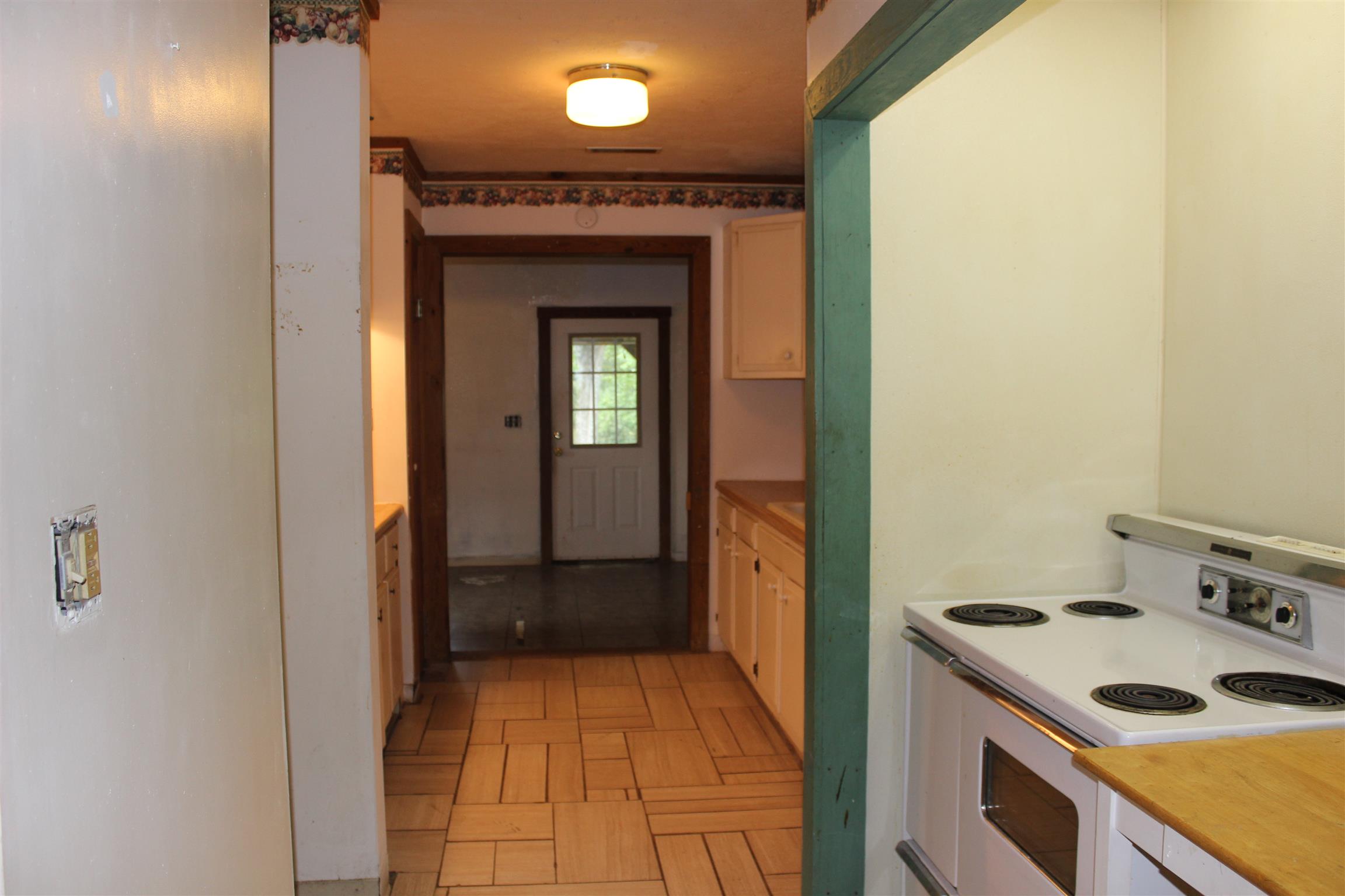 4029 Woodard Road Springfield, TN 37172 - Photo 3 of 16 a kitchen with a sink and a stove top oven