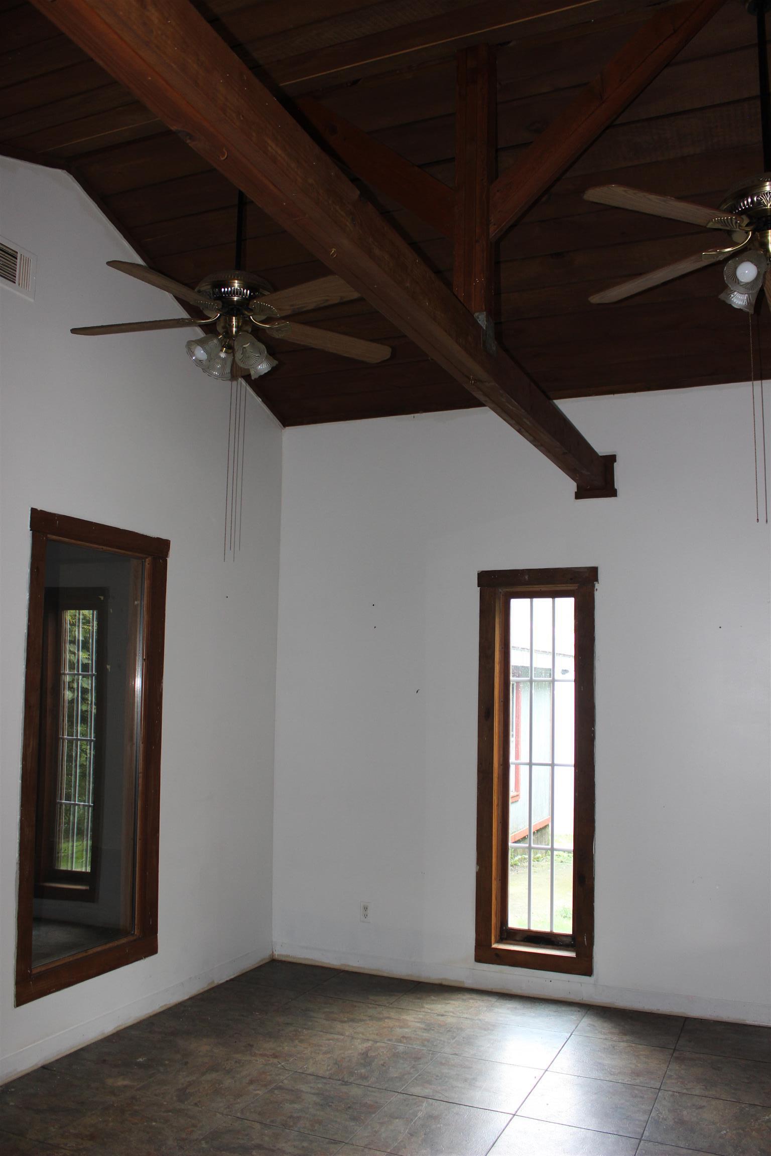4029 Woodard Road Springfield, TN 37172 - Photo 7 of 16 a view of an empty room with a window