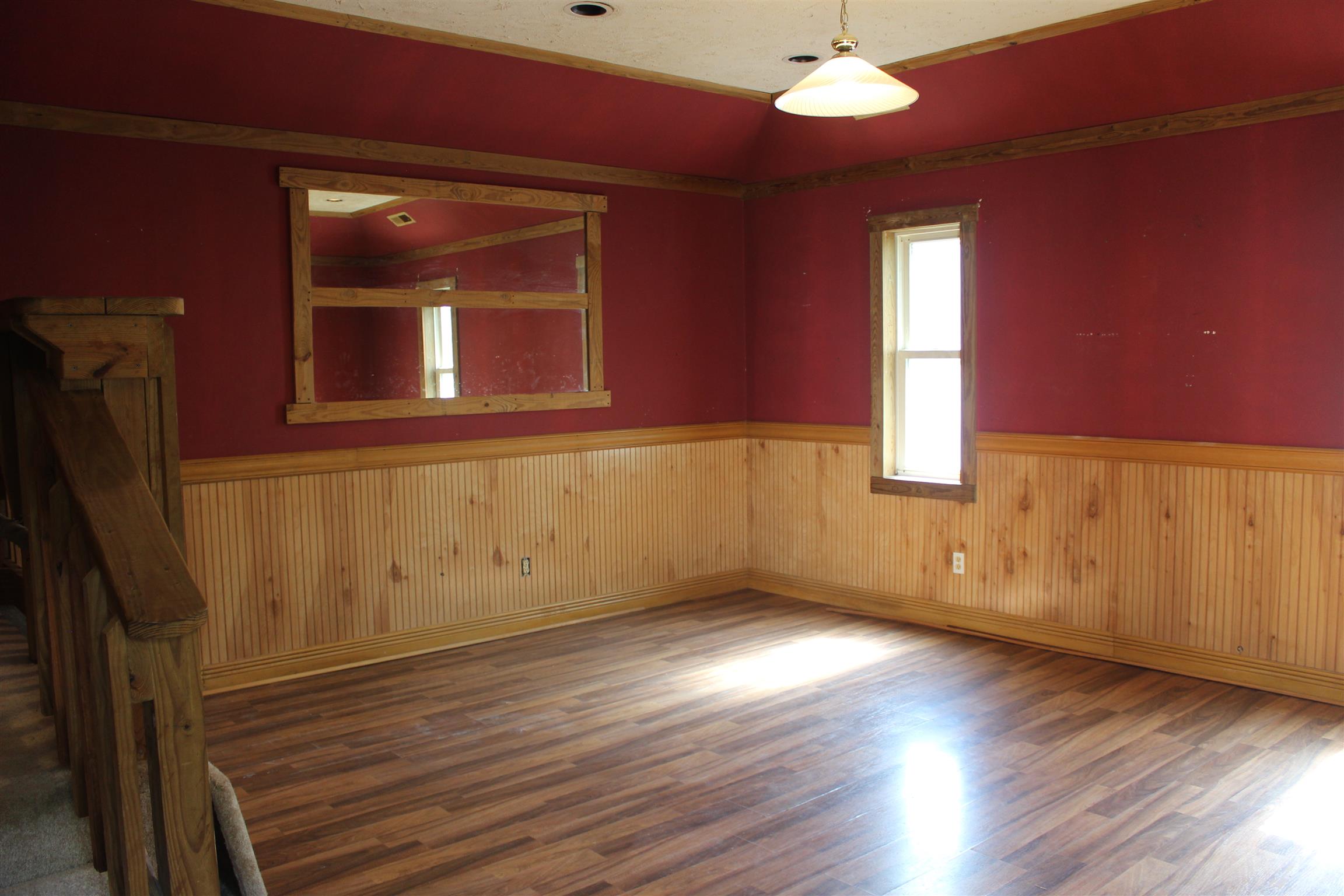 4029 Woodard Road Springfield, TN 37172 - Photo 8 of 16 a view of an empty room with wooden floor and a window