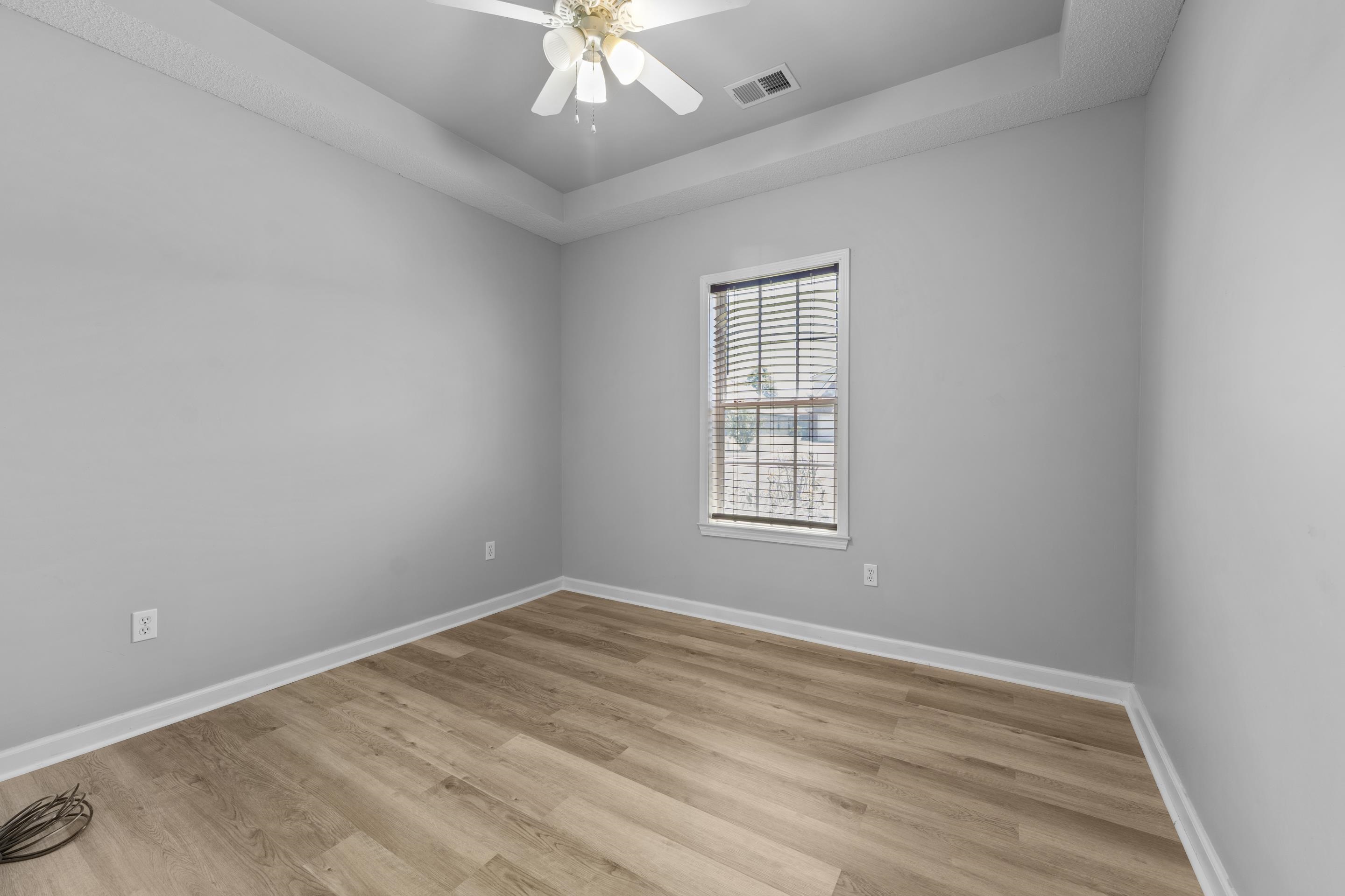 50 Abbey Road Oakland, TN 38060 - Photo 20 of 26 Room featuring light wood-finish flooring, light gray wall paint, and white trim