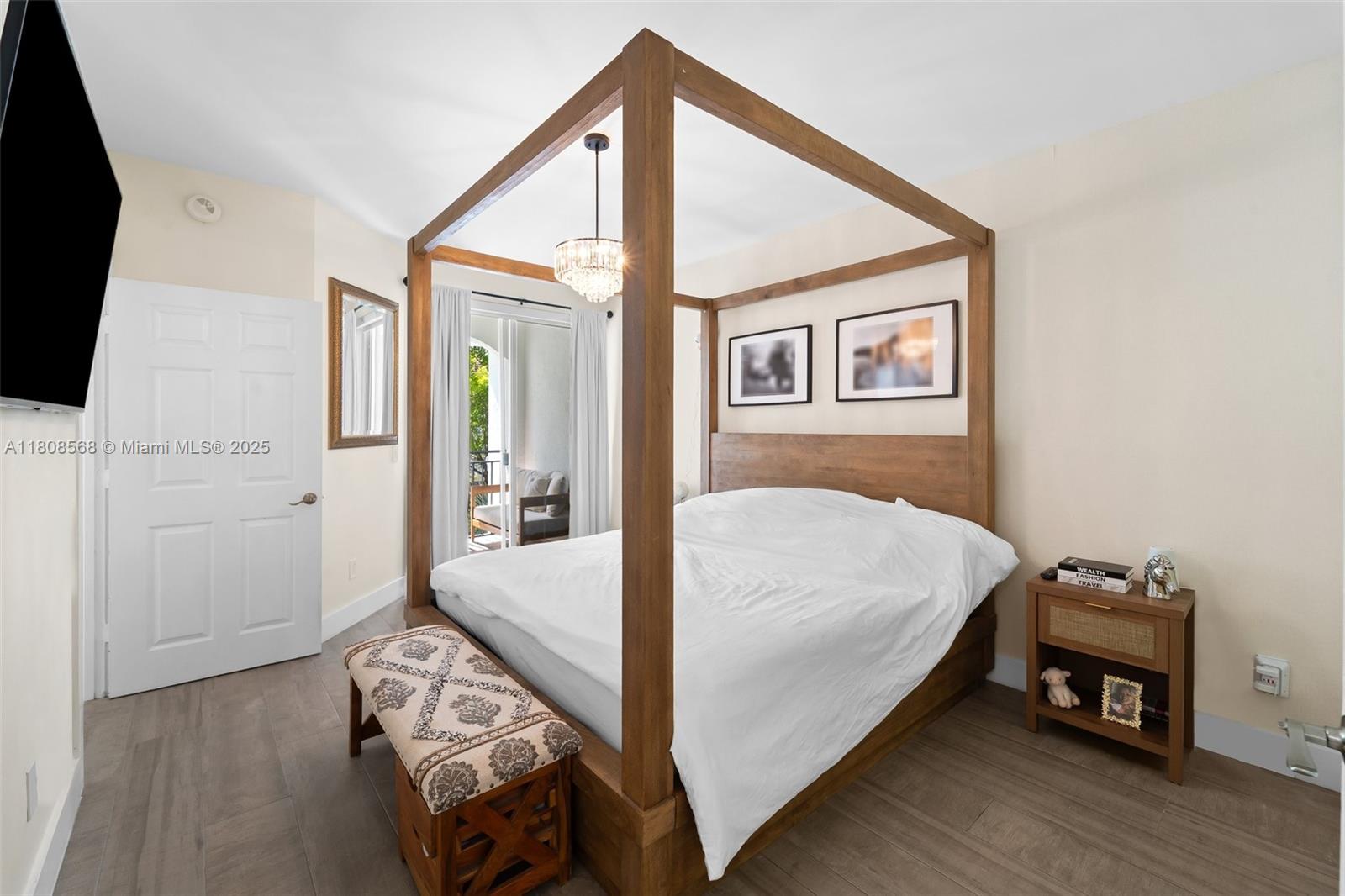 3245 Northeast 184th Street, Unit 13402 Aventura, FL 33160 - Photo 18 of 28 a bed room with a bed and a tv