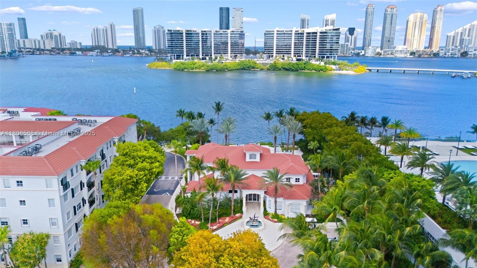3245 Northeast 184th Street, Unit 13402 Aventura, FL 33160 - Photo 25 of 28 a view of a lake with a city