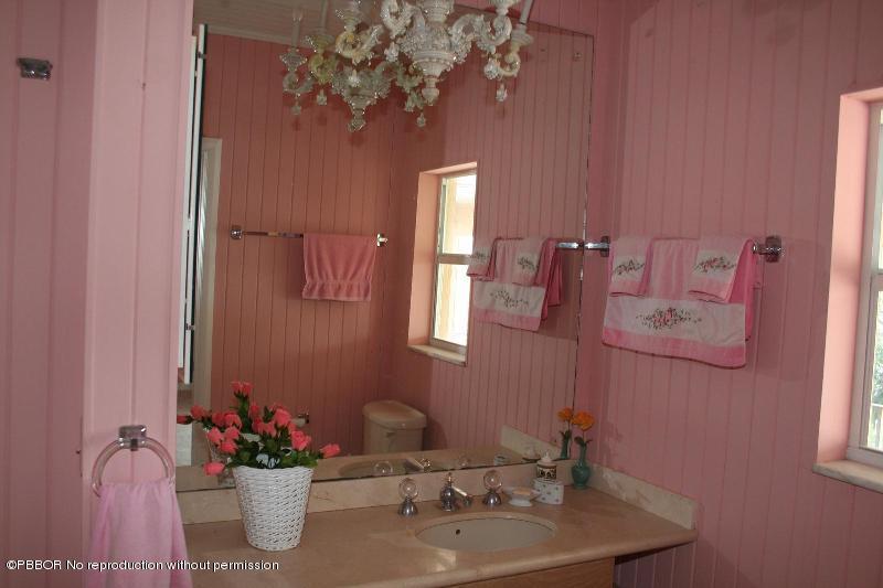 1515 Lands End Road Manalapan, FL 33462 - Photo 12 of 21 a bathroom with a sink mirror and vanity