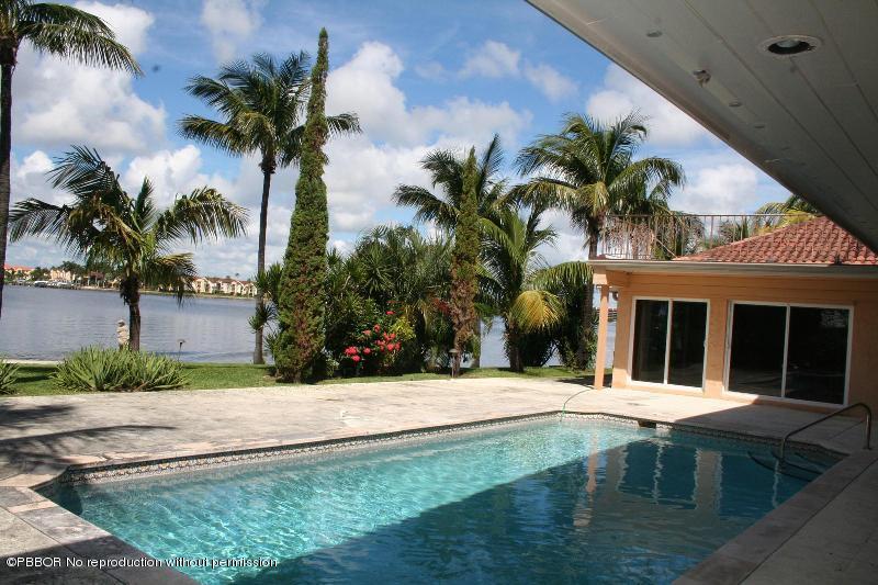 1515 Lands End Road Manalapan, FL 33462 - Photo 17 of 21 a view of a house with a swimming pool