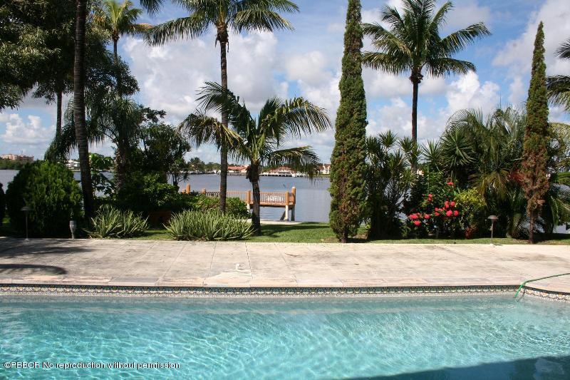 1515 Lands End Road Manalapan, FL 33462 - Photo 18 of 21 a white house with palm trees