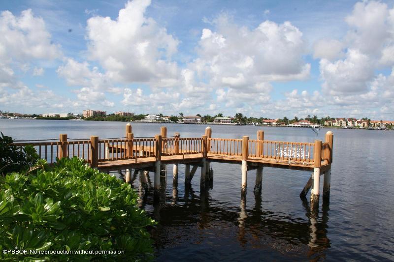 1515 Lands End Road Manalapan, FL 33462 - Photo 20 of 21 a balcony with outdoor seating and lake view