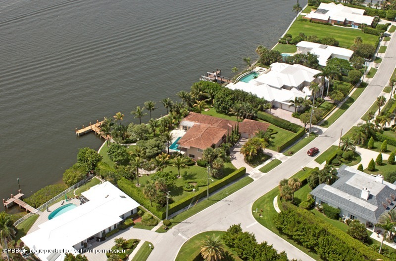 1515 Lands End Road Manalapan, FL 33462 - Photo 4 of 21 an aerial view of a house with a yard and black white umbrella