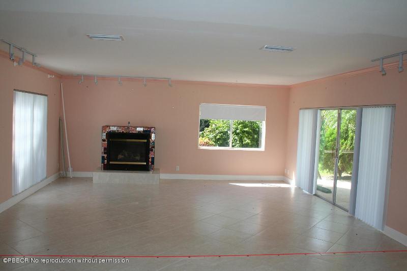1515 Lands End Road Manalapan, FL 33462 - Photo 6 of 21 an empty room with windows