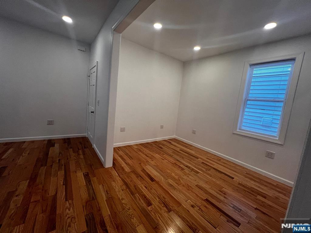 3 Montclair Avenue, Unit 2 Paterson, NJ 07503 - Photo 11 of 24 a view of a room with wooden floor and window