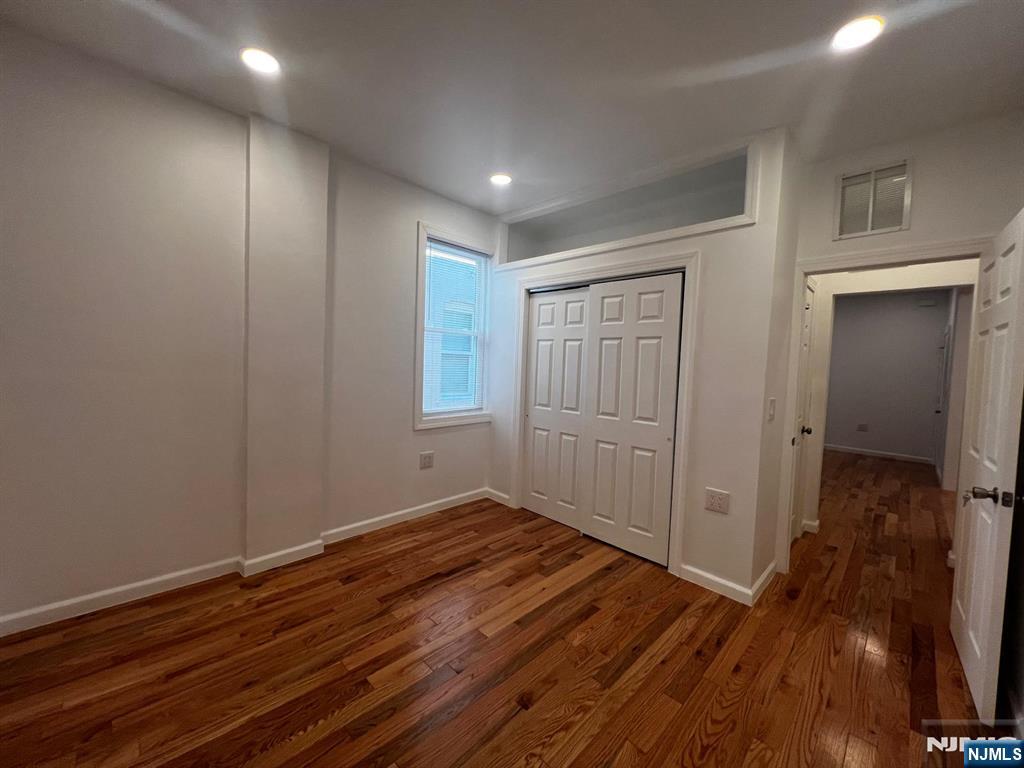 3 Montclair Avenue, Unit 2 Paterson, NJ 07503 - Photo 16 of 24 a view of hallway with wooden floor