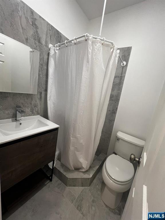 3 Montclair Avenue, Unit 2 Paterson, NJ 07503 - Photo 24 of 24 a bathroom with a sink toilet and shower
