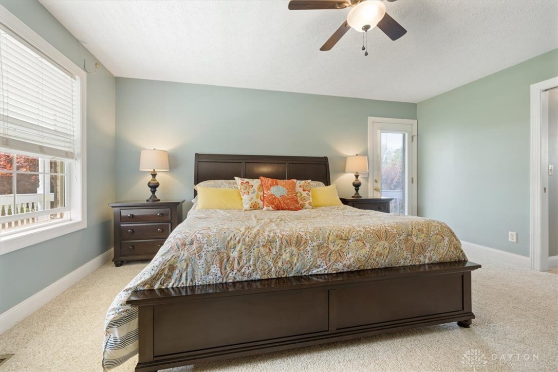 841 Willow Road Springfield, OH 45502 - Photo 18 of 64 This spacious primary bedroom features soft carpeting, large windows, and a private outdoor access.