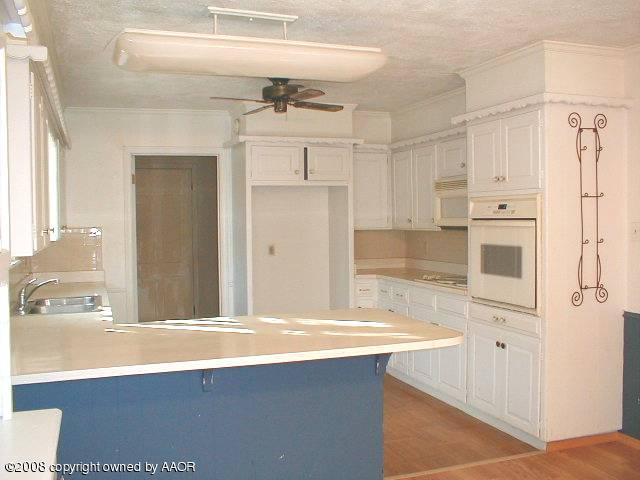 7204 Dreyfuss Road Amarillo, TX 79106 - Photo 8 of 14 a view of a kitchen with a sink