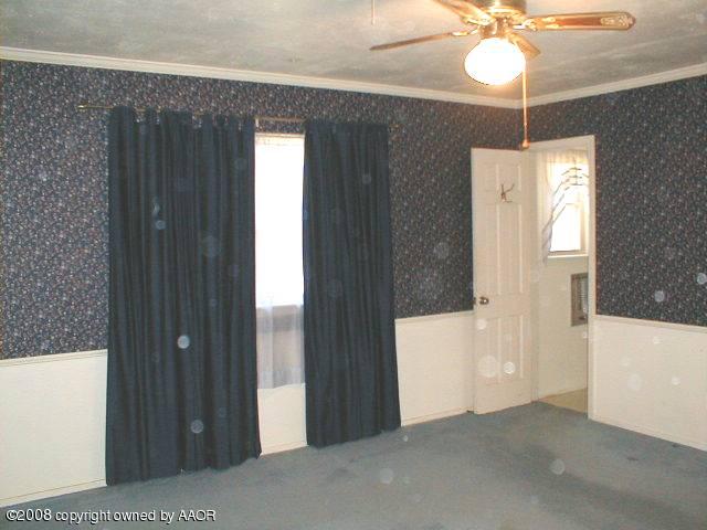 7204 Dreyfuss Road Amarillo, TX 79106 - Photo 9 of 14 a dinning room with chandelier fan and windows