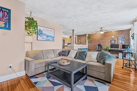 a living room with furniture and a rug