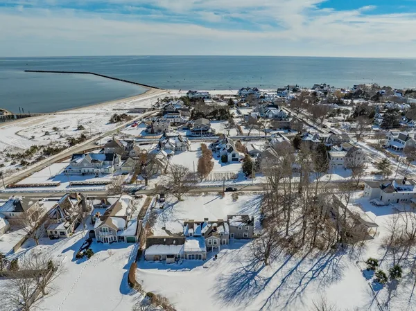 a building outdoor space with patio furniture and potted plants