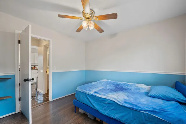 a bathroom with a sink mirror and toilet