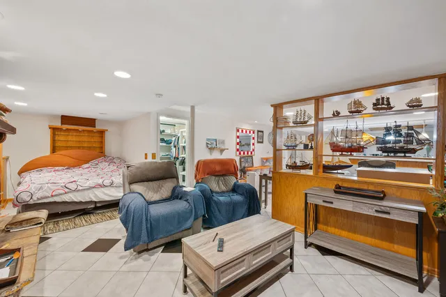 a kitchen with stainless steel appliances kitchen island granite countertop a sink and cabinets