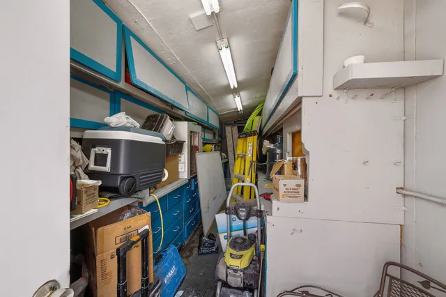 a view of a garage with a bike and wooden roof