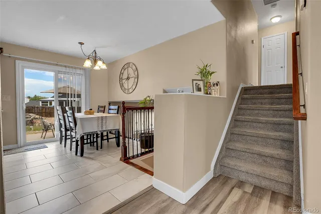 a view of dining room and hall with wooden floor