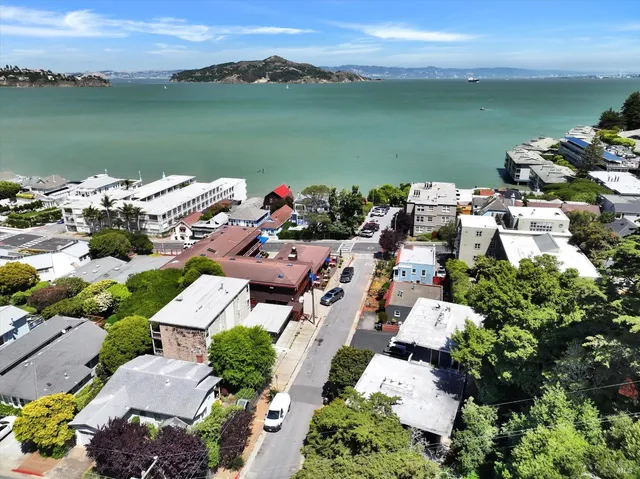 an aerial view of a house with a lake view
