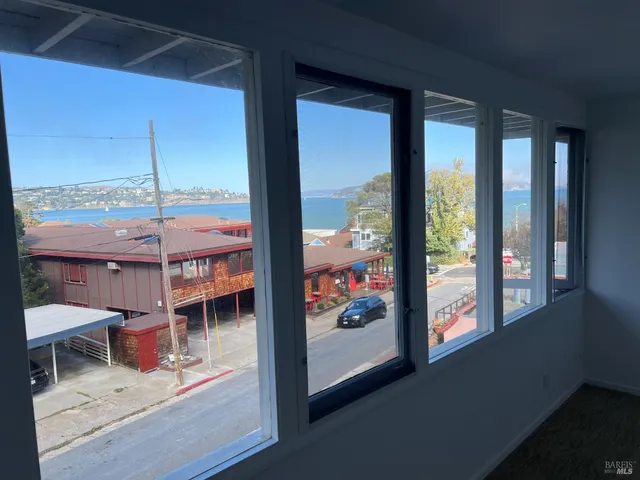 a view of a living room and a floor to ceiling window