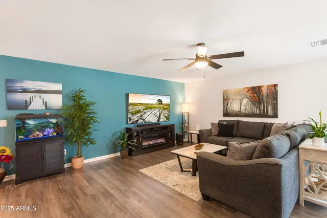 a living room with furniture and a large window