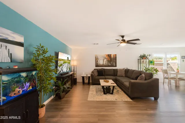 a view of a room with a ceiling fan