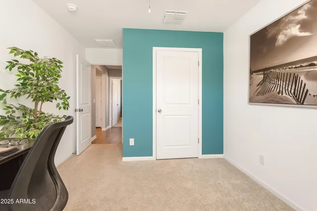 a view of a livingroom with furniture and a potted plant