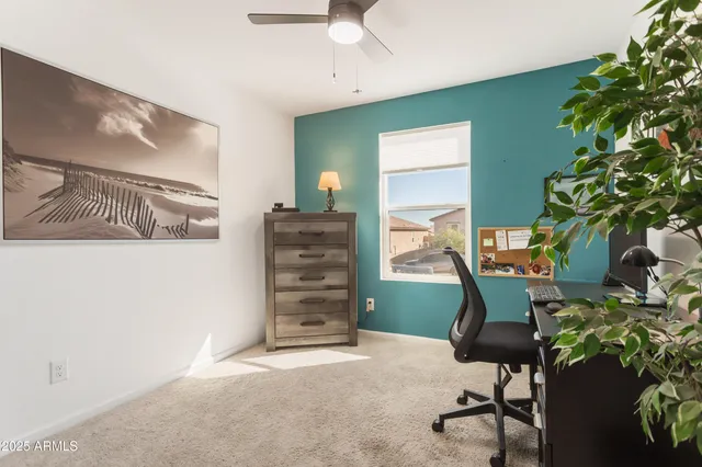 a bathroom with a sink vanity mirror and toilet