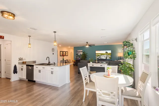 a view of a kitchen with a table and chairs