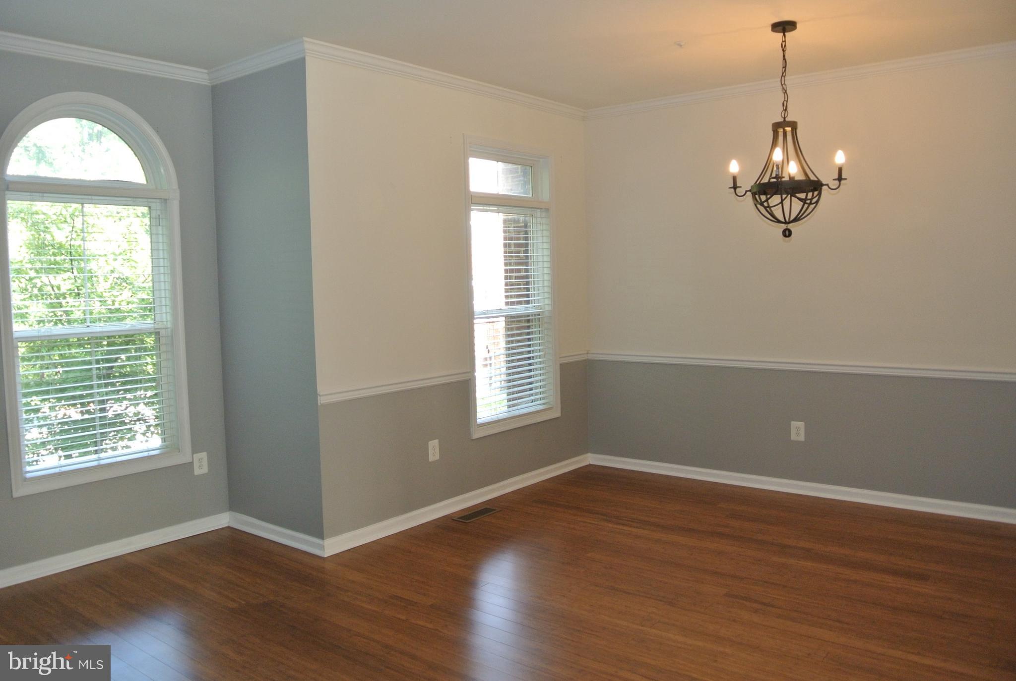 10205 Brighton Ridge Way, Unit 89 Columbia, MD 21044 - Photo 14 of 30 Dining Room with Chandelier