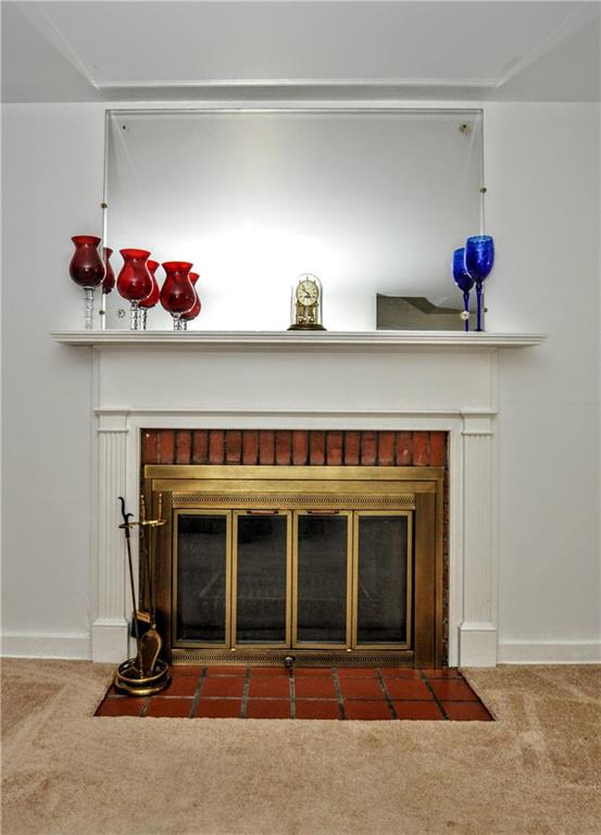1944 Bower Hill Road Pittsburgh, PA 15243 - Photo 6 of 23 a living room with a fireplace and cabinets