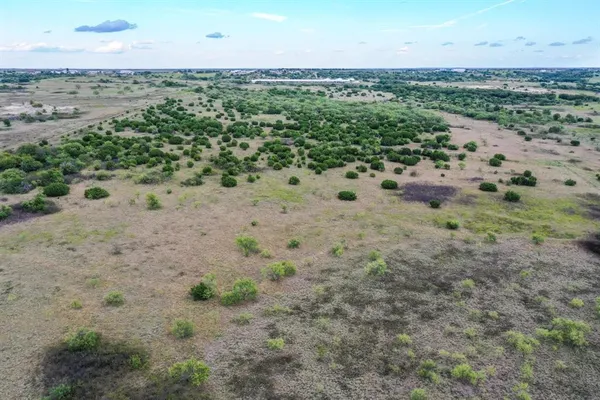 an aerial view of beach and yard