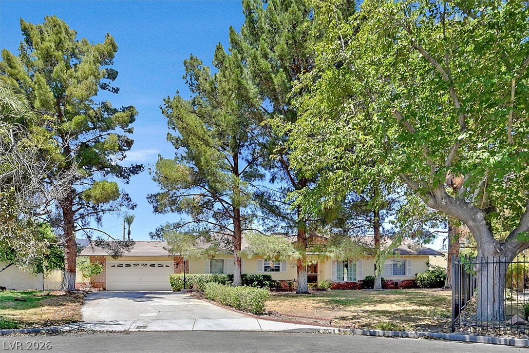 3618 Fieldcrest Road Las Vegas, NV 89121 - Photo 1 of 36 Mature trees frame this charming single-story residence, offering ample curb appeal.