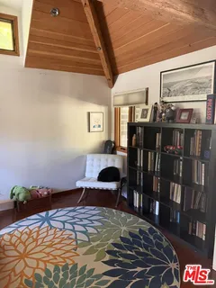 a bedroom with furniture and window