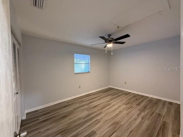 1029 10th Street Northwest, Unit A Largo, FL 33770 - Photo 14 of 21 wooden floor in an empty room