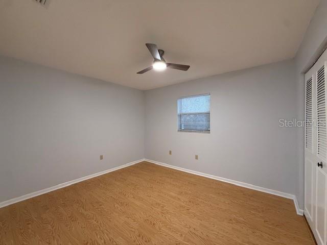 1029 10th Street Northwest, Unit A Largo, FL 33770 - Photo 15 of 21 an empty room with a fan & a window