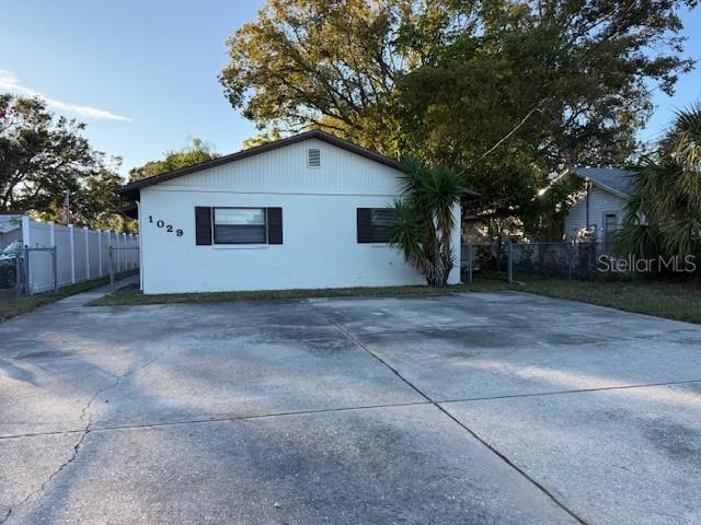 1029 10th Street Northwest, Unit A Largo, FL 33770 - Photo 2 of 21 a house view with a backyard