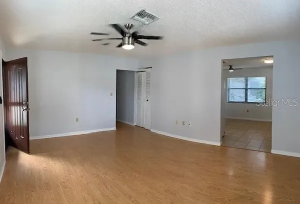 wooden floor in an empty room and a window