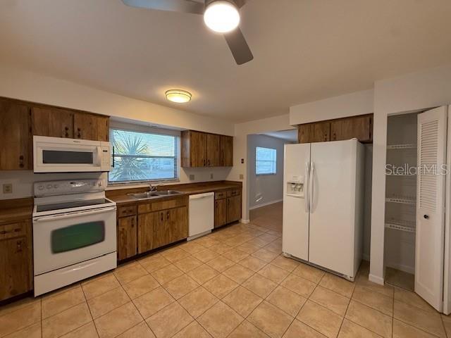 1029 10th Street Northwest, Unit A Largo, FL 33770 - Photo 7 of 21 a kitchen with stainless steel appliances granite countertop a refrigerator and a sink