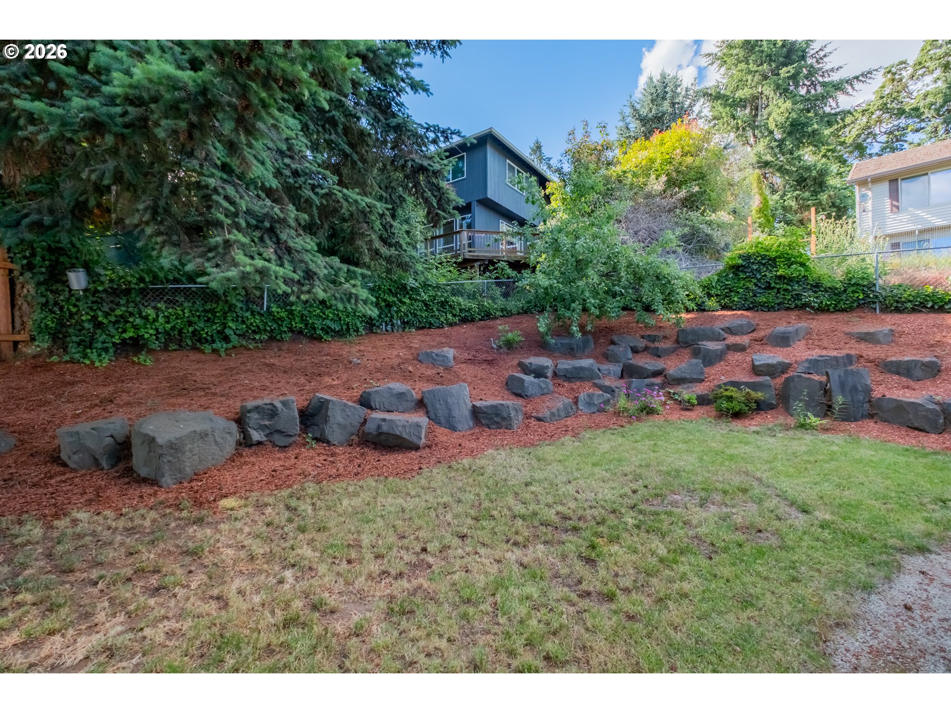 2925 Doaks Ferry Road Northwest Salem, OR 97304 - Photo 46 of 47 a view of a backyard with plants and a yard