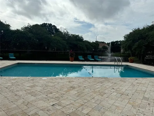a view of swimming pool with a yard