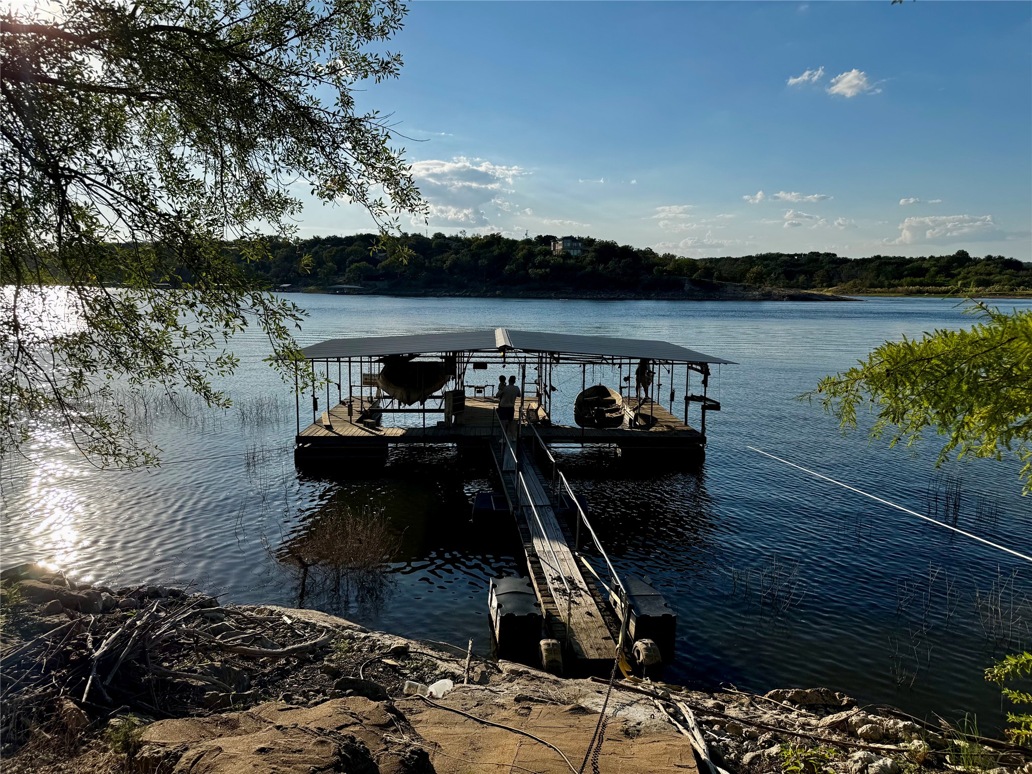 Beautiful waterfront property with dock and two slips on the Pedernales. Just around the bend from Lake Travis.